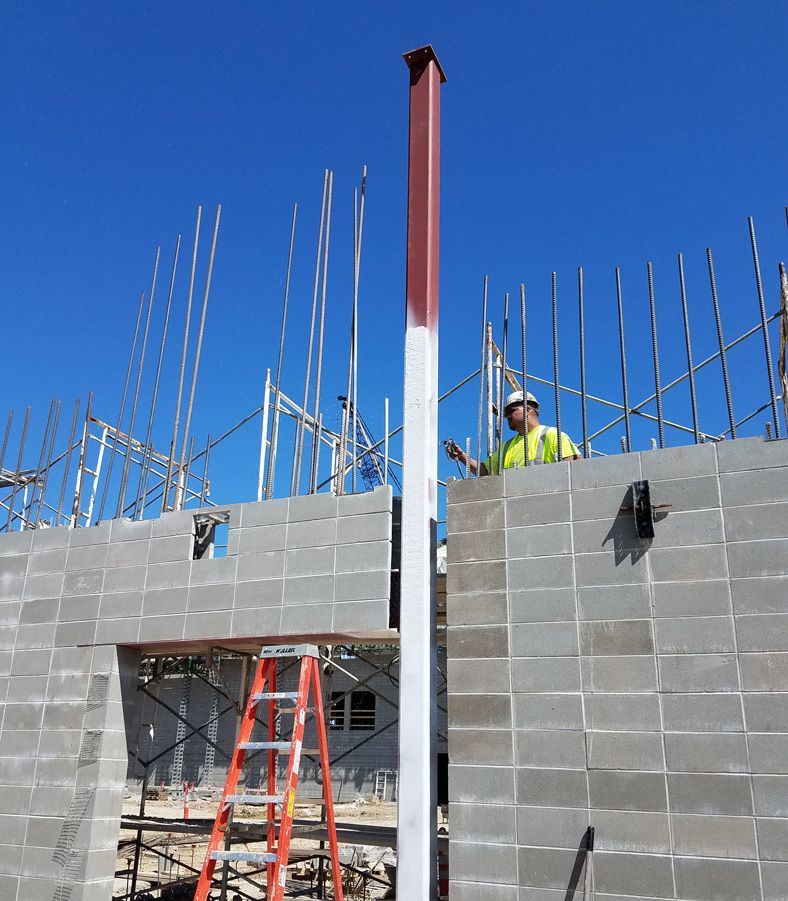 intumescent fireproofing spray being applied to a commercial building